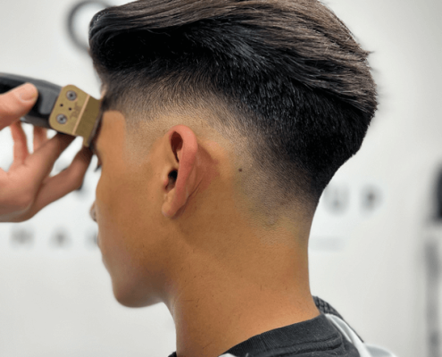Barber Giving Fresh Fade Haircut at Change It Studio in Hidden Gym Barber Giving Fresh Fade Haircut at Change It Studio in Hidden Gym